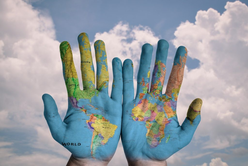 Image Hands With The World Map Sky Background